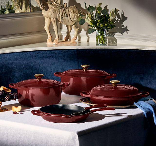 assorted cookare items in wine red